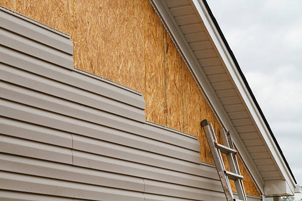Professional Siding technician working in Ottsville, PA